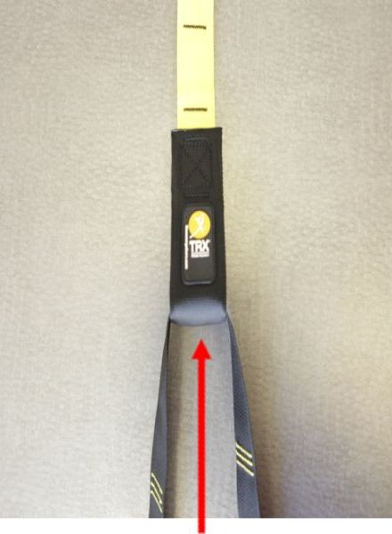 Picture of recalled suspension trainer device indicating absence of a nylon locking loop