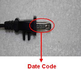 Picture of the recalled iron's plug, showing location of date code