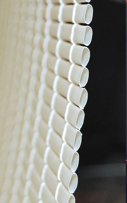 Oval Roll-up Blinds and Woolrich Roman Shades