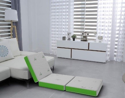 Recalled Cushy Form Tri-Fold Folding Mattress setup as extra seating.