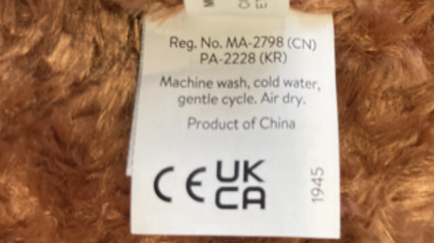 Location of manufacturing date code on the recalled Bubba Bull Plush Toy tag