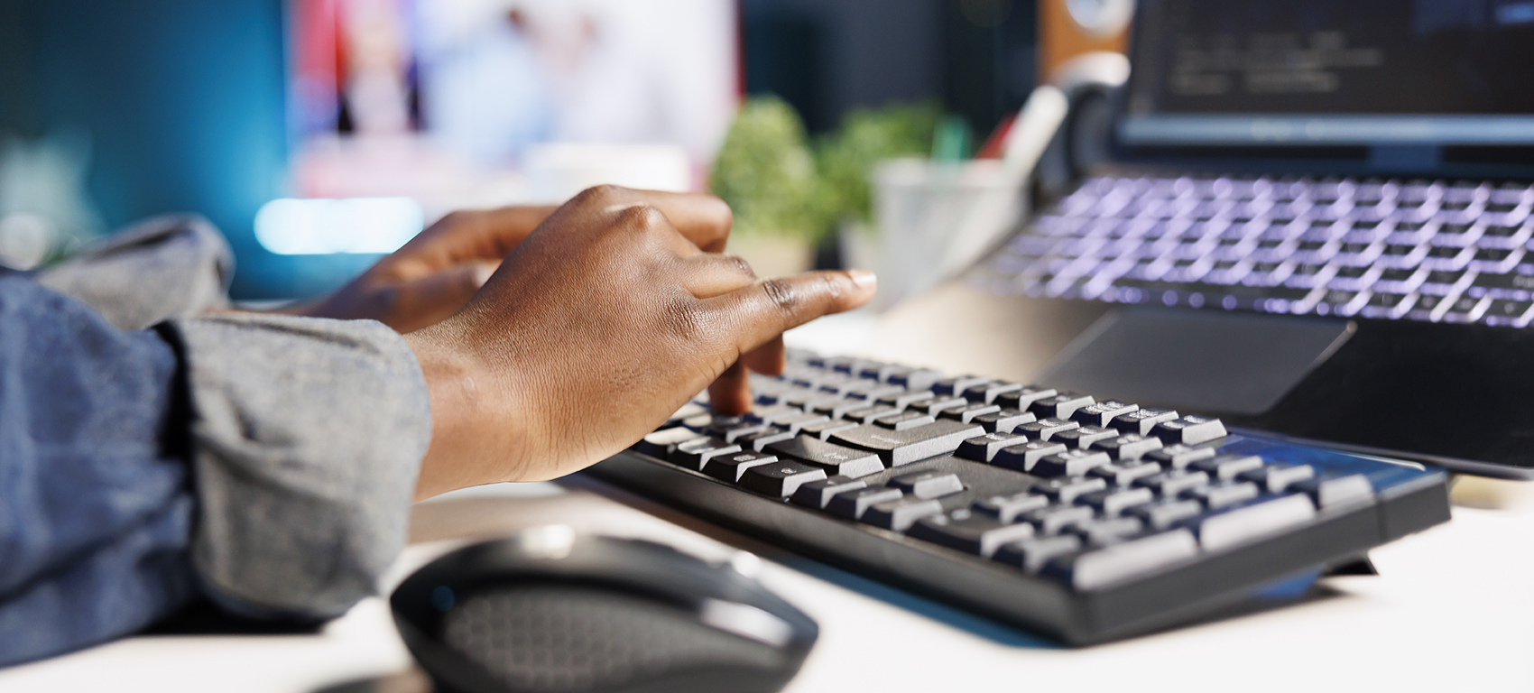 Image of someone typing on a keyboard
