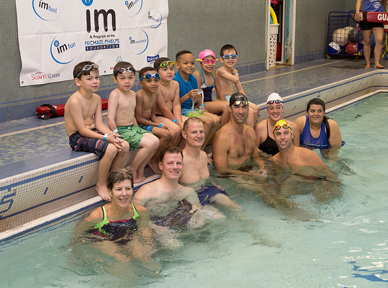 Group photo with Michael Phelps at the Pool Safely Safer Summer Swimming event