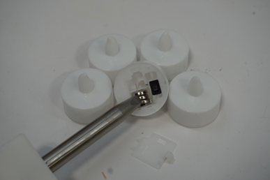 Each of the recalled Besslly tea lights has three preinstalled button cell batteries