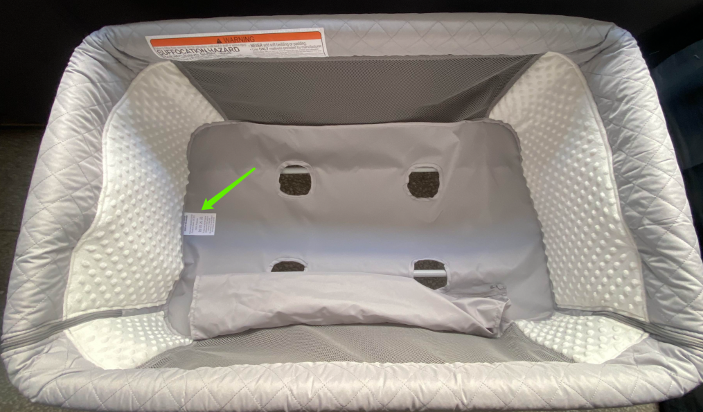 "Product Model: QX-831" is printed on a label located on bottom of the convertible bassinets underneath the mattress pad