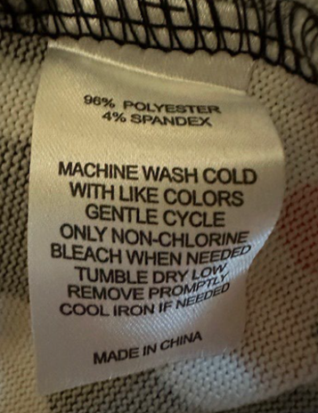 "Made in China", and "96% polyester 4% spandex" printed on the sewn-in side seam label