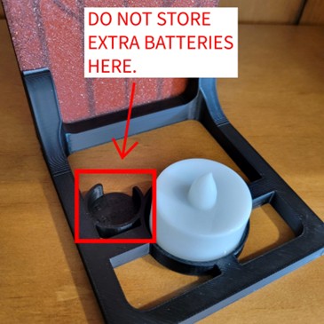 Location of spare battery holder in base of recalled Prismatic 3D Prints Book Nooks Fantasy Window