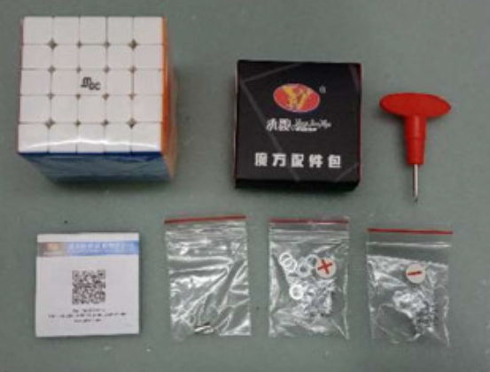 Recalled CuberShop Magnetic Stickerless Speed Cube packaging and game contents including spare magnets packaged separately in a sealed plastic bag