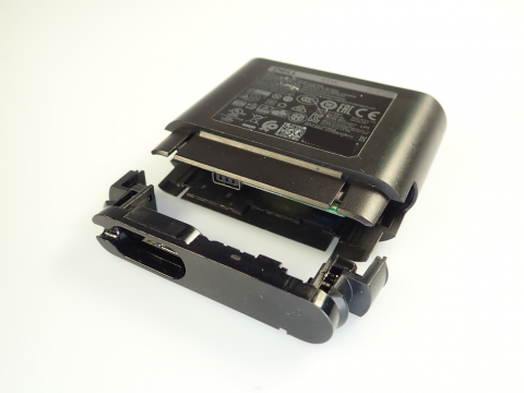 Detached casing of recalled Dell Hybrid Power Adapter sold with Dell Power Banks.