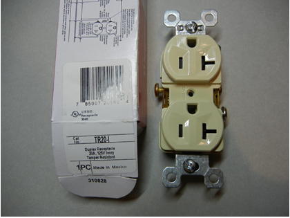 Front view of recalled receptacle with packaging and model number circled in red