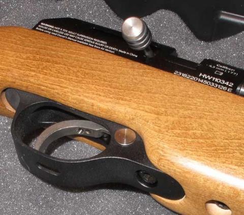 Gen 2 trigger with hole in the trigger guard for adjustment of screws.