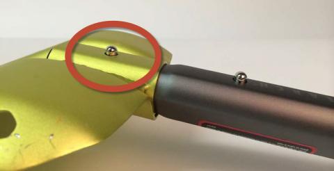 Lower lock button on the back of shovel