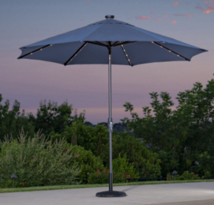 The recalled 10-foot Solar LED Market Umbrella with a round back solar puck at the top of the umbrella