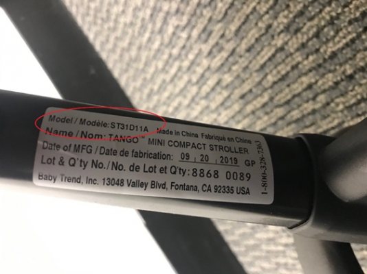 Recalled stroller model number is printed in black on a white sticker attached to the stroller’s leg