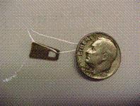 Metal tab of recalled Faux-Shearling Infant Booties