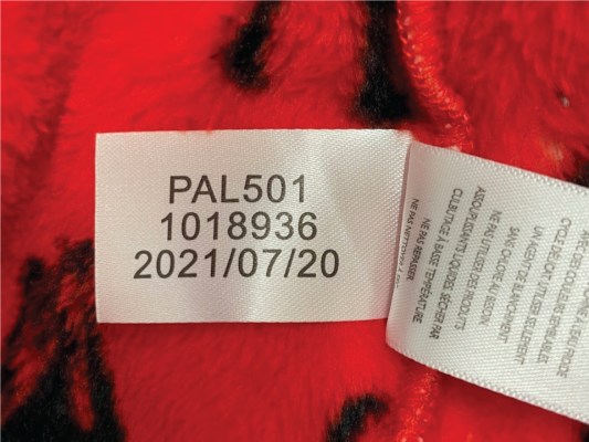 Location of tracking numbers on side seam label on pajamas