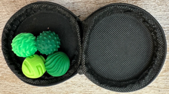 Violative Magnetic Sensory Fidget Balls inside black storage case 