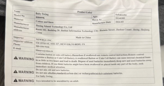 Product label located on the back of the infant swing seat