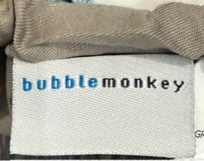 “Bubble monkey” is printed on a label stitched on the outside of the baby lounger’s cover.