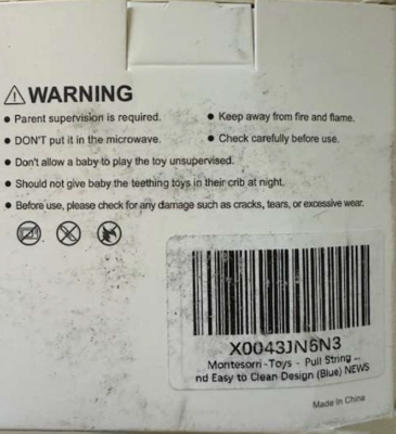  “X0043JN6N3” is printed on a label on the back of the Etetoo pull string toy’s packaging.      