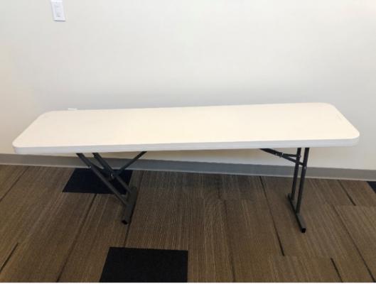 Recalled seminar table with over-rotated brace arm.