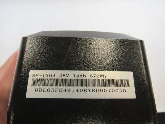 Battery label (rear view; some units only)
