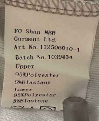“FO Shan MBB Garment Ltd.” and art number “132506010-1, JWA6000_BKG” or “JWA6001_PKB” are printed on Mikrdoo Children’s Pajamas sewn-in seam label.