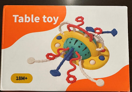 “Table Toy” is printed on the front of the teething toy packaging
