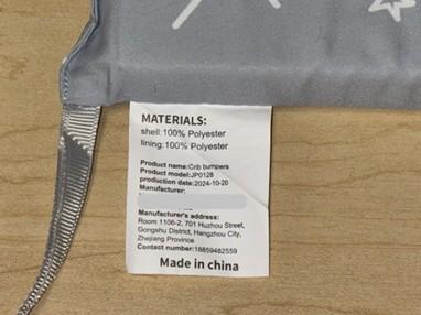 “Product model: JP0128” on tracking label on the crib bumper 