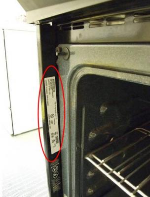 Slide-in serial plate—left side of recalled oven with door open