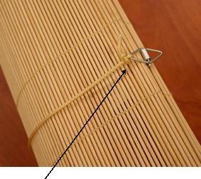 Recalled roll-up blind with release clips (included in this recall)