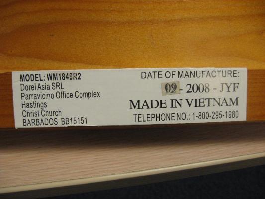 Example of a label found on one of the side rails. Not all labels will identify &quot;Dorel Asia SRL&quot; in the text