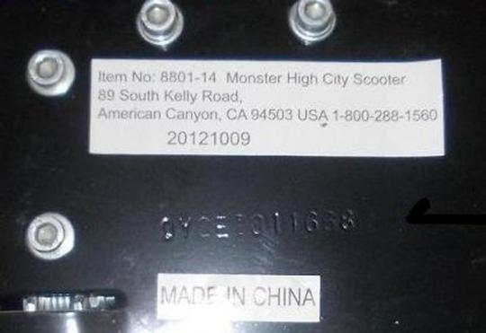 The model number and the manufacture date are printed on a label on the underside of the scooter