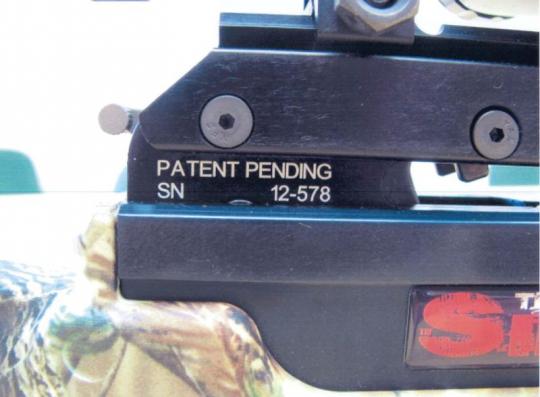 The unique serial number (12-XXX) is printed on the crossbow