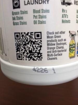 Date codes are printed on the back of the bottle near the QR code