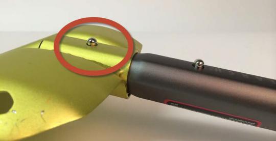 Lower lock button on the back of shovel