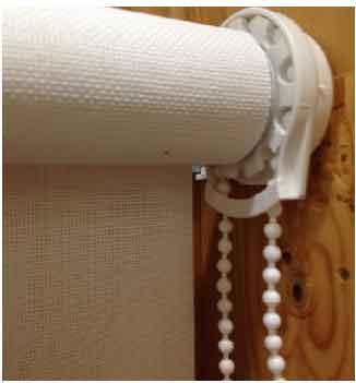 Recalled Carra Imports roller shade with a continuous loop bead chain