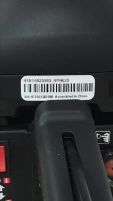 Model and serial numbers and the manufacture date are located on a white label above the rear handle.