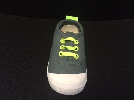 Skidders Footwear gray fabric with green rivets and laces