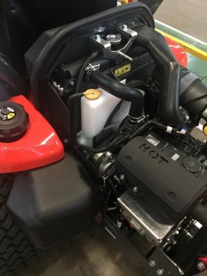 The coolant reservoir is white with a yellow cap.