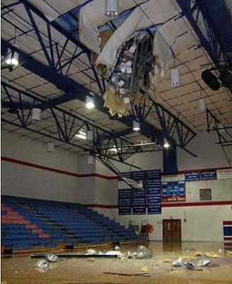 Recalled stadium light pole fallen through gymnasium roof