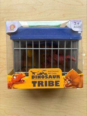 Recalled Dinosaur Toy Packaging Containing Electronic Gray and Blue Cage with a Red Dinosaur