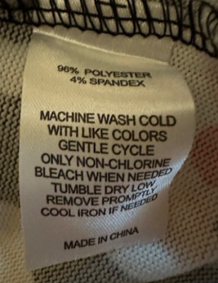 “Made in China”, and “96% polyester 4% spandex” printed on the sewn-in side seam label