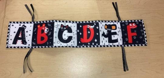 Crib bumper that came with the recalled LXDSTRA baby lounger – alphabet