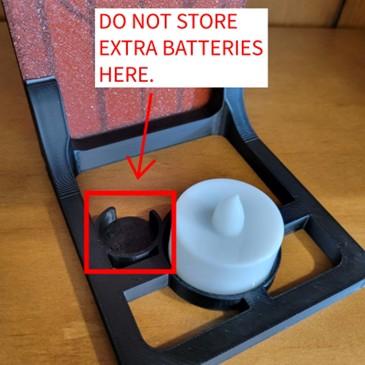 Location of spare battery holder in base of recalled Prismatic 3D Prints Book Nooks Fantasy Window