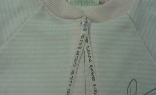 Close-up of recalled infant jumpsuit with ribbon