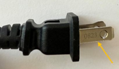 Date code etched on prong of recalled hair curling iron plug