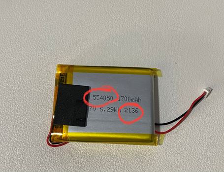 Recalled battery showing model of battery 554050 and the batch number 2136 located inside the battery pack portion of the plush camera