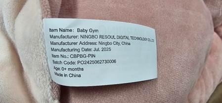 “Baby Gym” and “Item No.: CBPBG-PIN” are printed on a label stitched to the product on the edge of the mat at the bottom