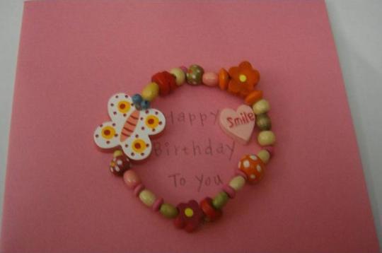 Recalled greeting card with bracelet